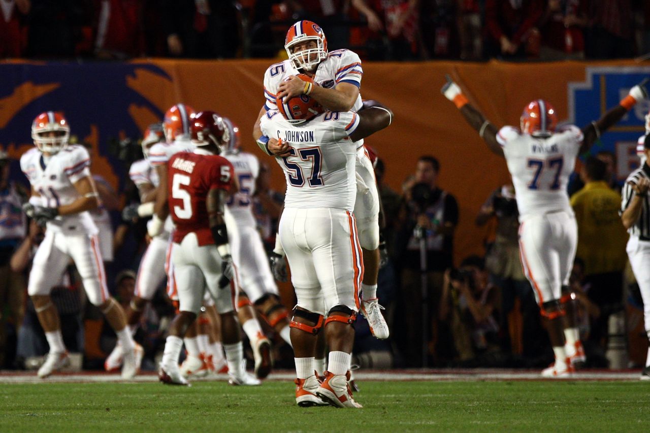 Tebow celebrates with teammate Carl Johnson after throwing a touchdown during the 2009 BCS National Championship game against Oklahoma. The Gators won 24-14.
