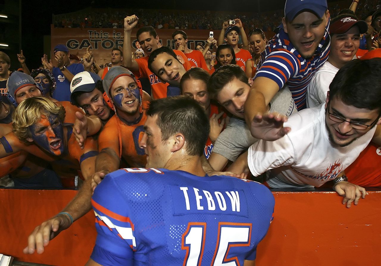 Florida fans greet Tebow after the Gators defeated Southern Mississippi in September 2006. Tebow rushed for a touchdown on the first play of his college career.