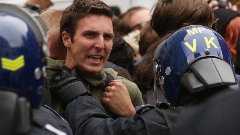 Police hold off protesters in London's Golden Square on June 11.