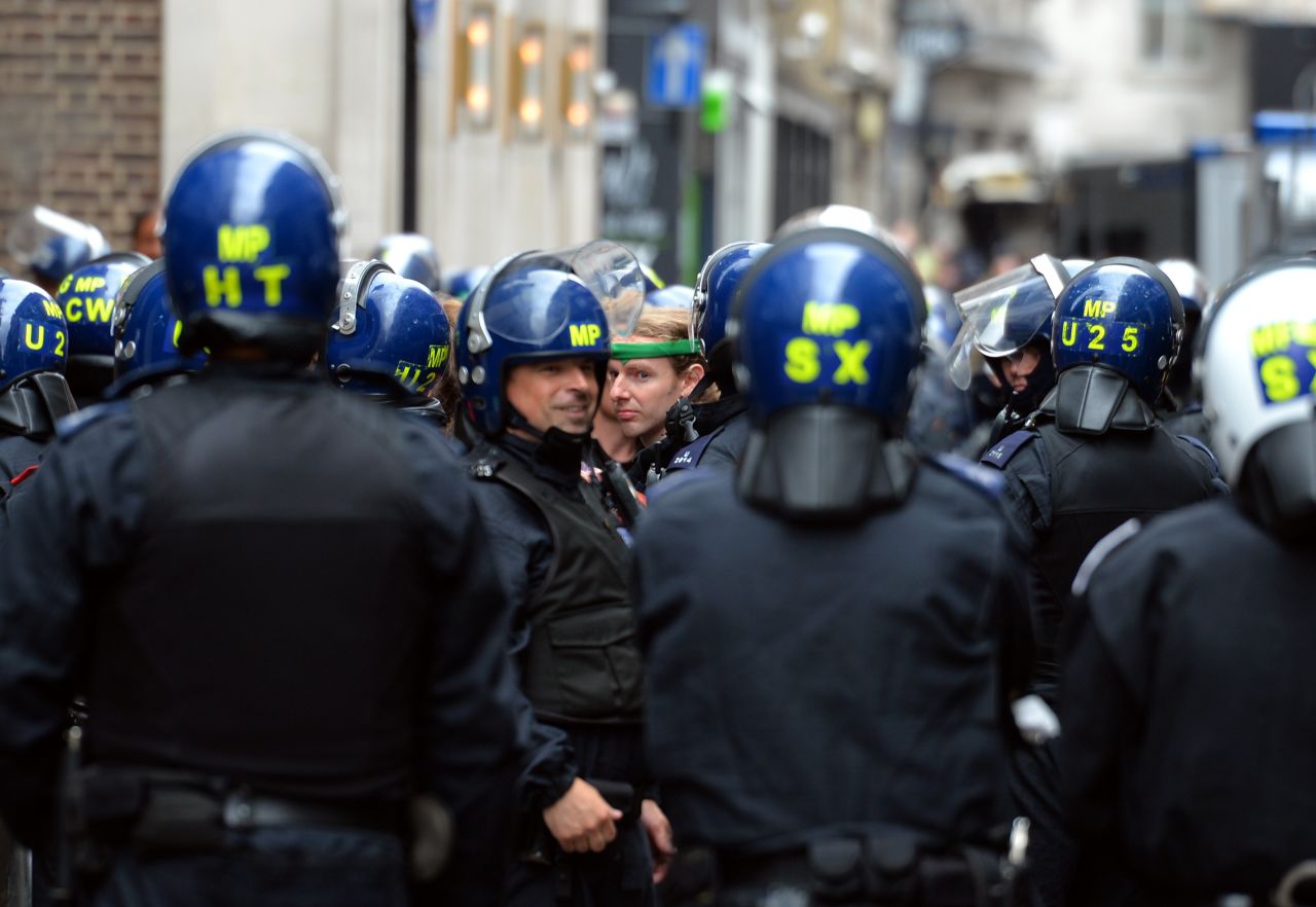 Officers move through central London on June 11.