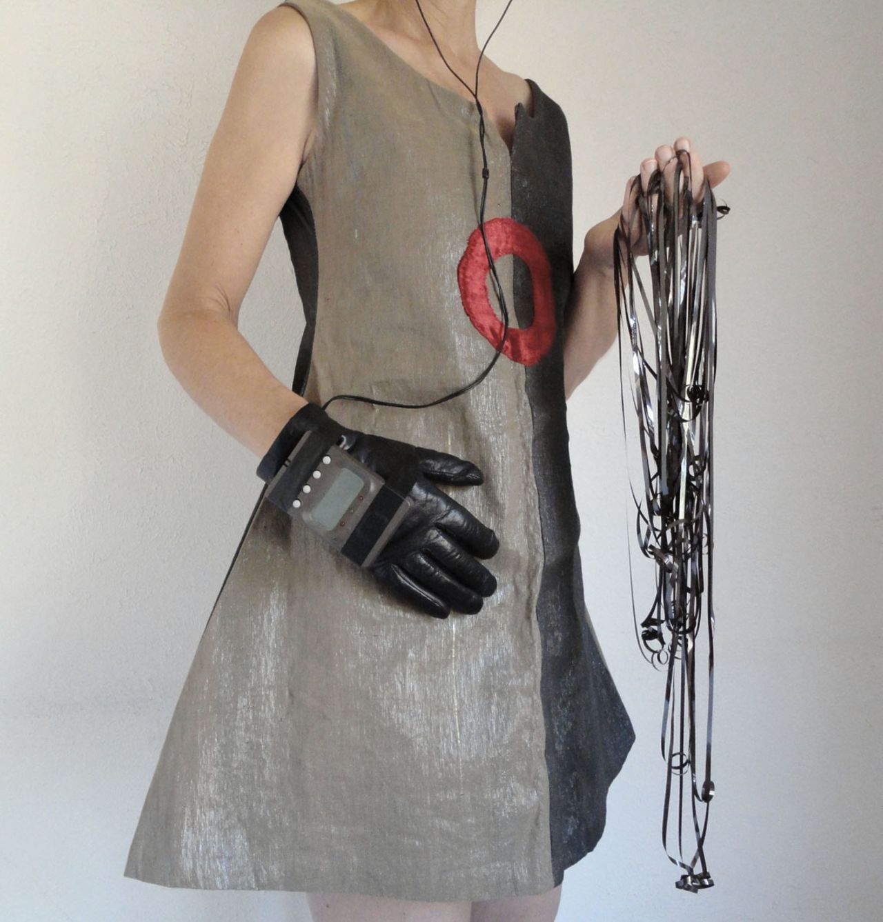Half beige and half gray, the 'sonic superhero dress' was the first garment Santoro made in 2003. It used 100 individual cassette tapes recorded with a range of sounds -- mix tapes, ocean surf, Laurie Anderson, Beethoven, The Beatles and her high school punk band