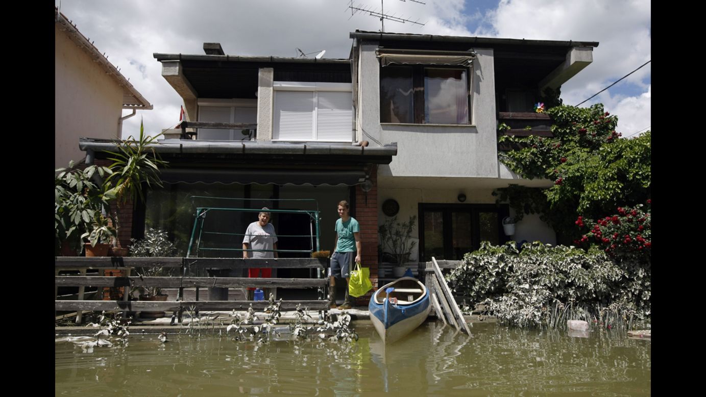 People salvage items from their house, which was flooded by the Danube River, in Dunakeszi, Hungary, on June 12.