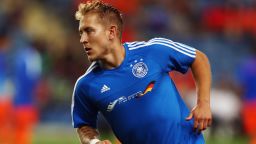 Germany captain Lewis Holtby wears a specially made training shirt with the Israeli flag and the words "Feeling at home" embroidered on the front to thank the host fans for making the team welcome at the European Under-21 Championship.