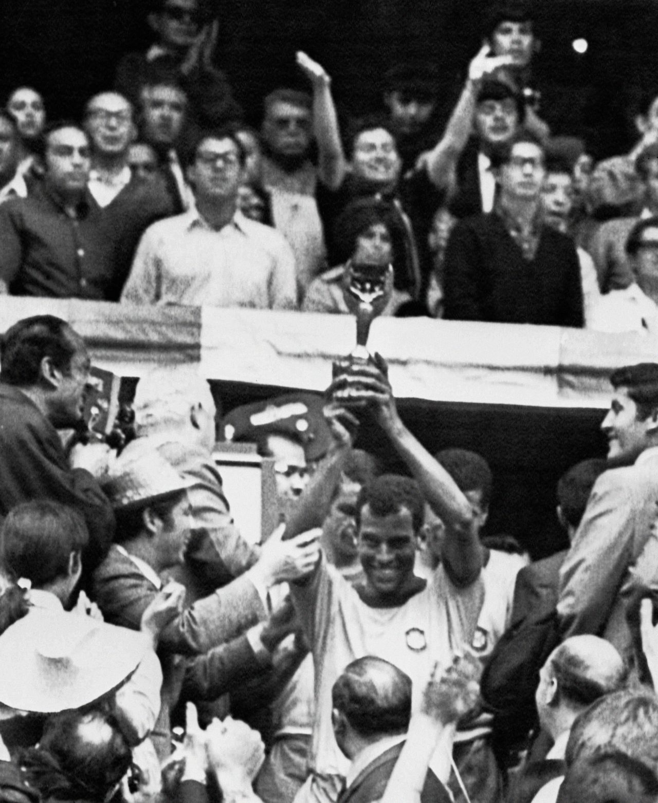 Carlos Alberto, captain of the 1970 team, lifts the Jules Rimet trophy which Brazil was allowed to keep after becoming the first nation to win the World Cup three times. The former fullback thinks next year's World Cup will come too soon for Brazil's inexperienced team.