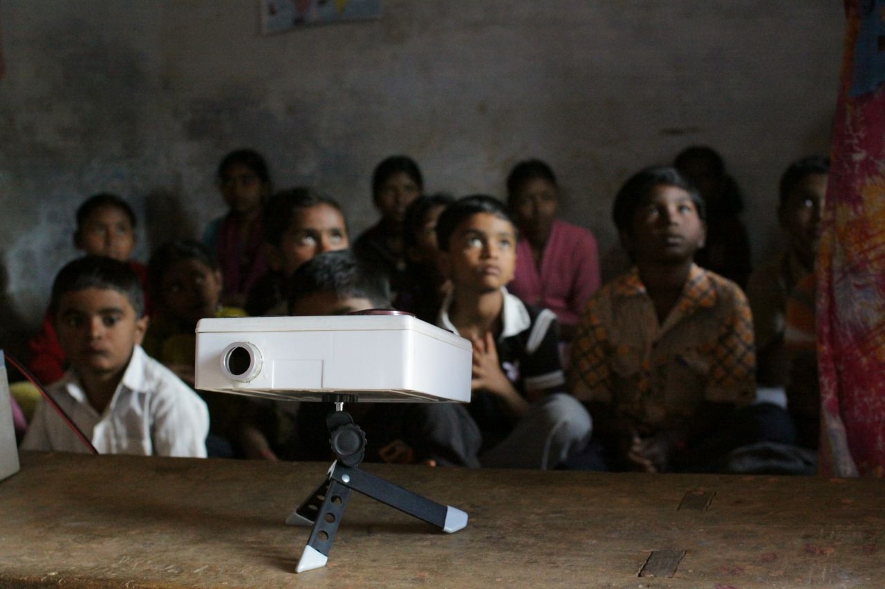 In consultation with local communities, Frugal Digital developed Darshana, a low-cost lunch box projector for use in schools. The projector is fitted with a small USB 2.0 port and uses a phone touch screen as a trackpad.