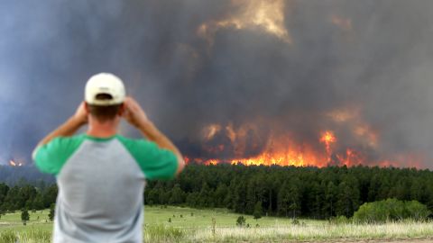 Schad Dohl watches a wall of fire as it rages through the Black Forest near Colorado Springs on Wednesday, June 12.