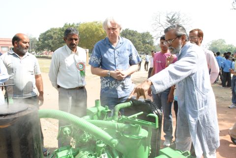 Professor Anil Gupta shows Hollywood film director James Cameron a biomass gasifier invented by Raj Singh Dahiya. Dahiya was born into humble circumstances, but taught himself engineering from a young age. The gassifier -- developed over 20 years -- creates fuel from farm waste bringing power to otherwise isolated areas of the country to light houses, filter water, and run mills.