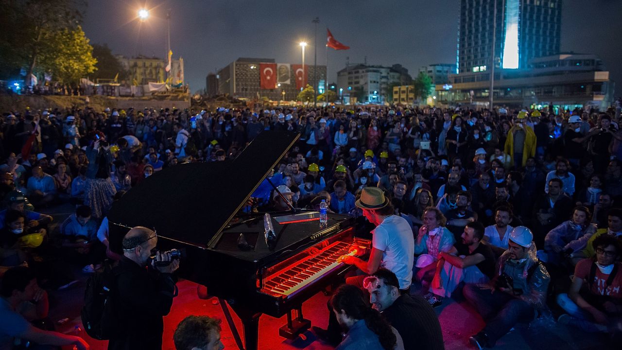 Protesters listen to a piano performance at Taksim Square on Tuesday in Istanbul, Turkey. 