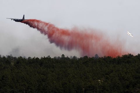  An airplane drops flame retardant over the Black Forest Fire on June 12 near Colorado Springs.