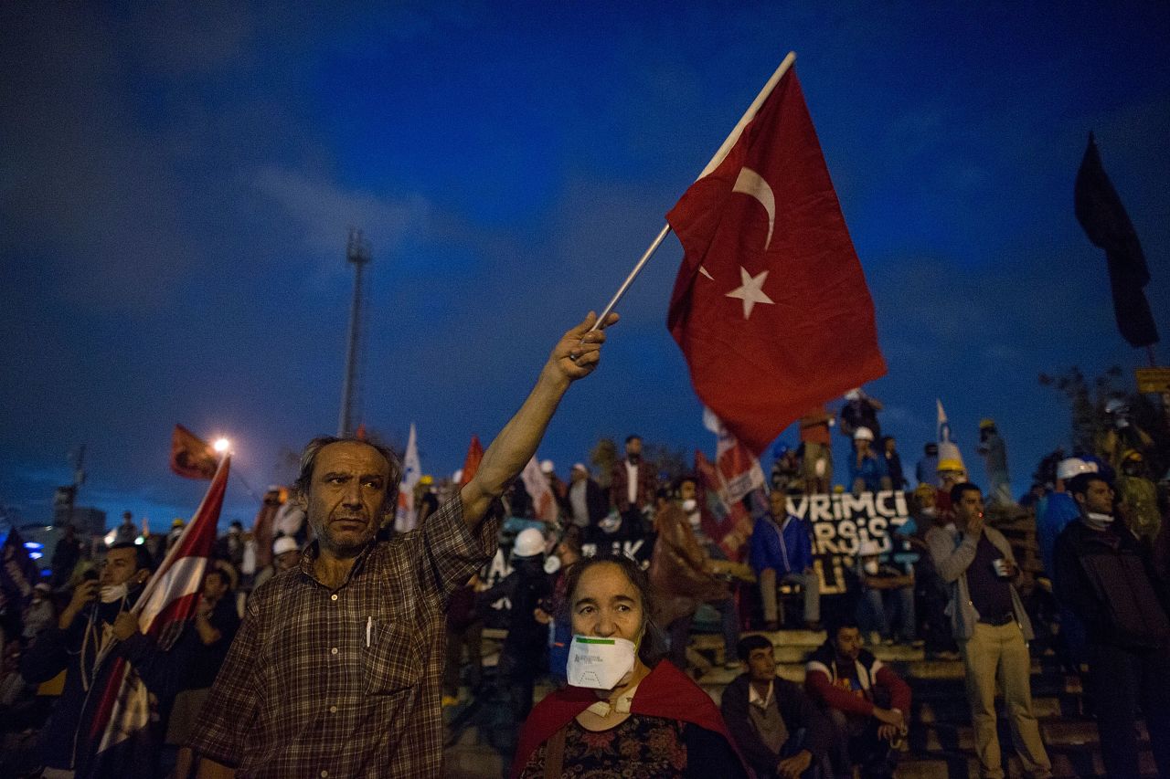 A man waves a flag in Taksim Square on June 12.