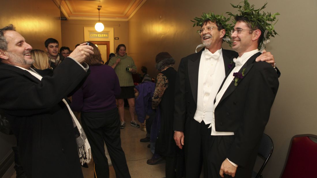 Jamous Lizotte, right, and Steven Jones pose for photos while waiting for a marriage license in Portland, Maine, on December 29, 2012.