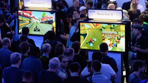 Gamers check out Nintendo's new video games at the Electronic Entertainment Expo (E3) Tuesday in the Los Angeles.
