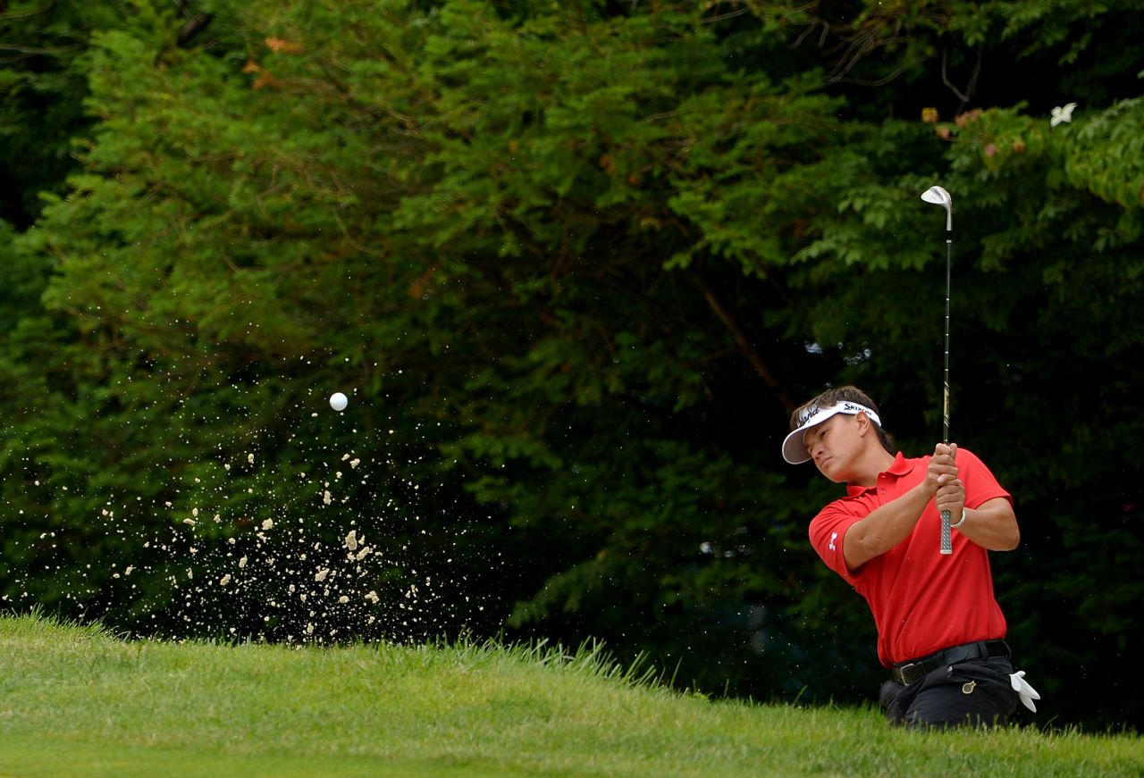 Ryan Yip of Canada hits his second shot out of a bunker on the 10th hole on June 13.