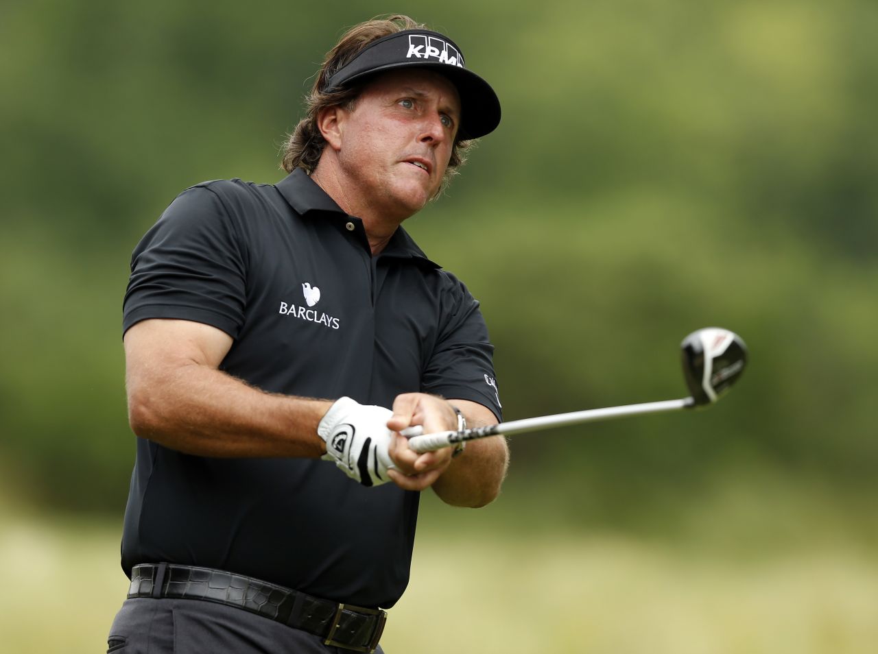 Phil Mickelson of the U.S. watches his shot from the tee of the second hole on June 13.