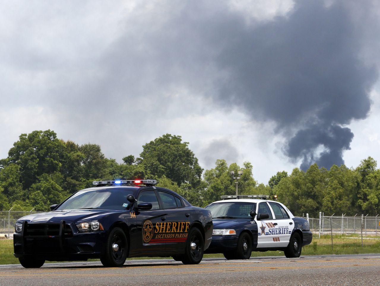 Police set up a roadblock as the area is evacuated.