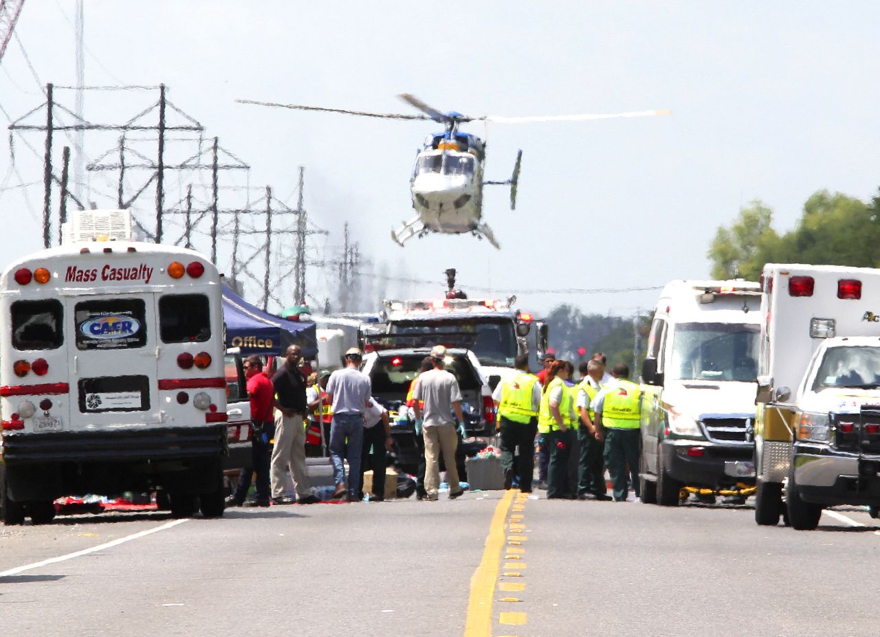 A medevac helicopter lands at a triage center set up near the chemical plant.