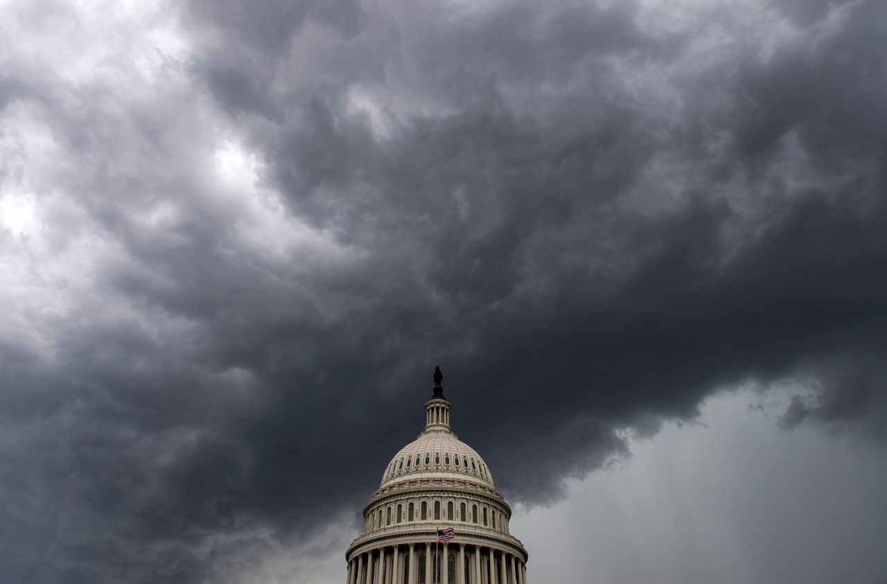 A strong line of thunderstorms approaches the Capitol with heavy rain and winds on Thursday, June 13, in Washington.