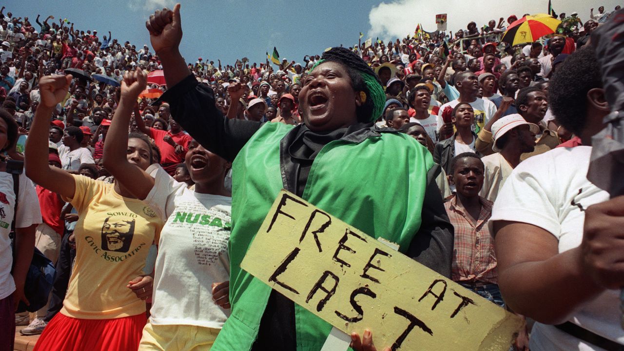 Jubilant residents of Soweto wait to hear newly freed Nelson Mandela speak at Orlando stadium February 12,1990. I