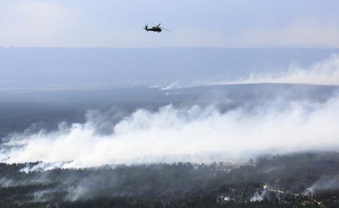 A Blackhawk helicopter patrols over the Black Forest Fire on June 13.