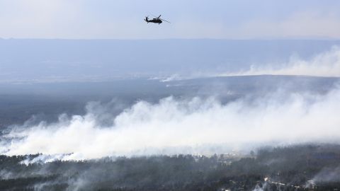 A Blackhawk helicopter patrols over the Black Forest Fire on June 13.