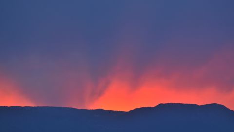 An orange sky highlights a fire on Thursday, June 13, that has been burning since June 11 near Colorado Springs.