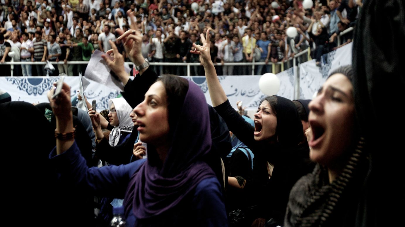Iranian supporters of former vice president and reformist presidential candidate Mohammad Reza Aref shout slogans during his campaign rally in Tehran on Monday, June 10. Later on Monday he announced his decision to drop out of the race. Hours earlier, another candidate, Gholam-Ali Haddad-Adel, also said he was out.