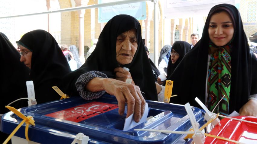 A woman casts her ballot during the Iranian presidential elections in Shahre-Ray, Iran, on Friday, June 14.