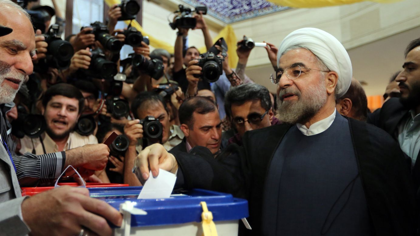 Presidential candidate Hassan Rouhani casts his vote in Tehran on June 14.