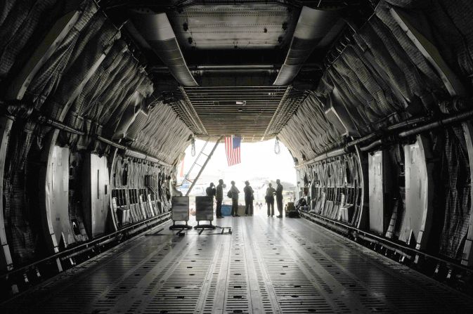 The C-5's cargo hold reaches 13.5 feet high. Its length <a href="http://www.af.mil/information/factsheets/factsheet.asp?id=84" target="_blank" target="_blank">stretches 143 feet, nine inches</a> -- about 23 feet longer than the length of <a href="http://airandspace.si.edu/exhibitions/gal100/wright1903.html" target="_blank" target="_blank">the first flight by the Wright brothers</a>. 