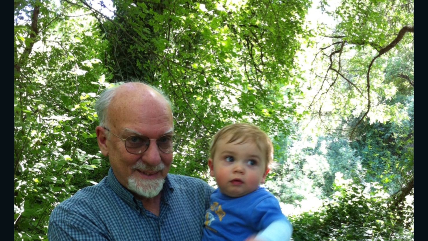 Bruce Bridgeman, shown with his grandson Nicholas Bridgeman Fields, can see the details of trees again.