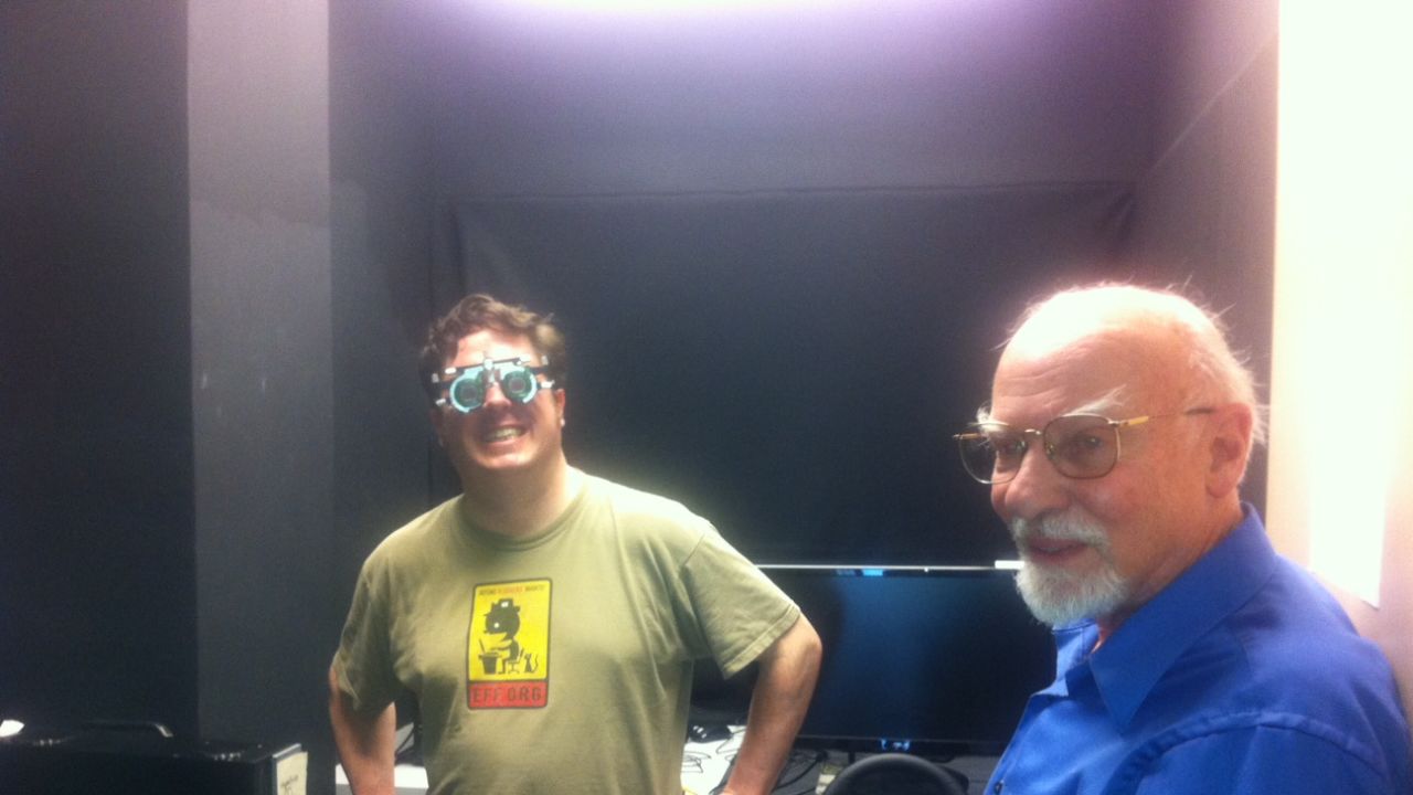 Paul Sosbee, left, tries out a driving simulator that Bruce Bridgeman is studying.