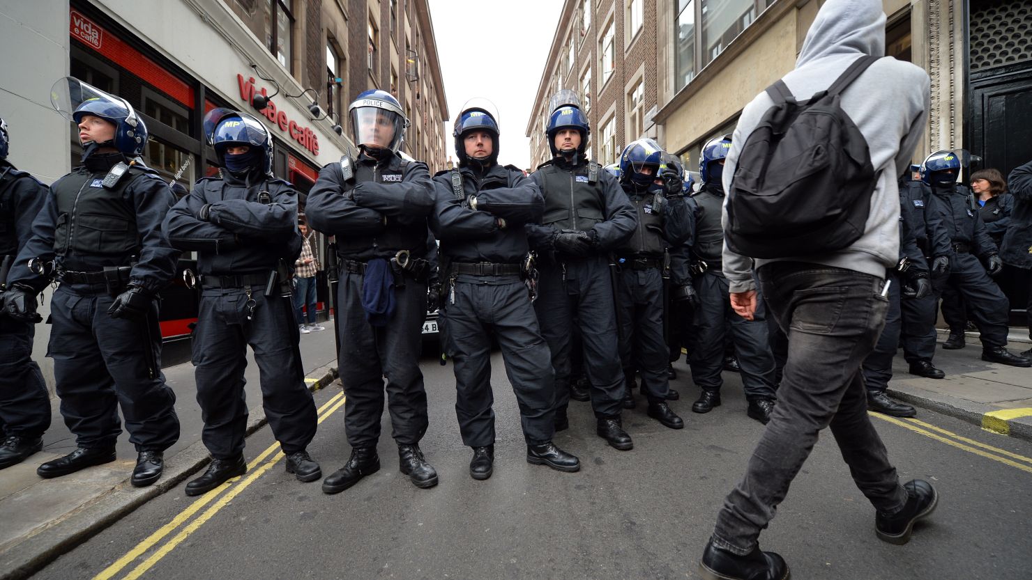 Security is high in London ahead of the G8 summit in Northern Ireland. Riot police stand guard as protests start.
