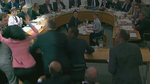 Deng made headlines in 2011 when she stopped a protester from hitting Murdoch with a shaving cream pie during a UK parliamentary hearing concerning allegations of phone hacking by his company. Above, Deng stops activist and comedian Johnnie Marbles from throwing the pie in Murdoch's face on July 19, 2011, in this still taken from video.
