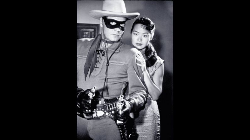 Moore, as the Lone Ranger, protects a lady in distress.