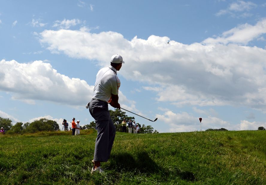 Tiger Woods of the United States hits a chip shot on the eighth hole during round two.