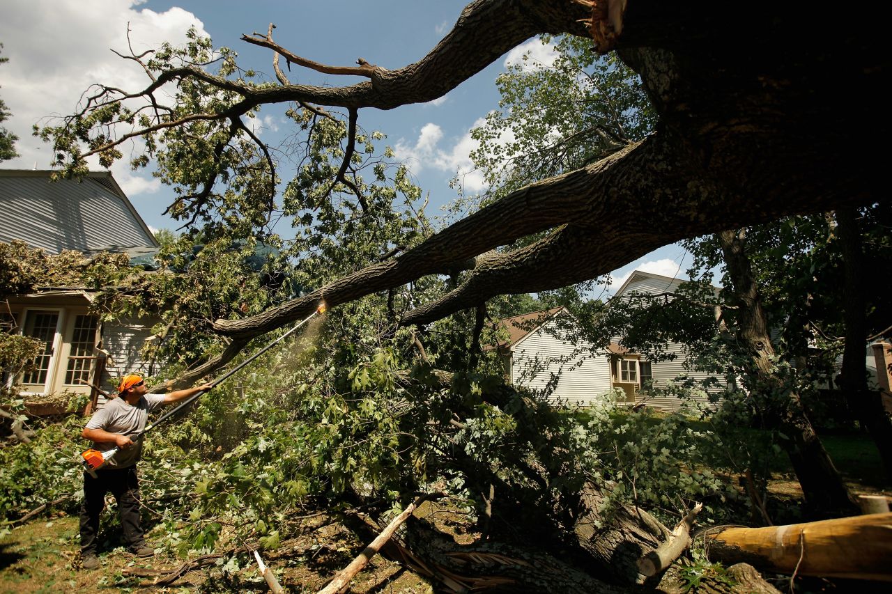 Leveled trees are cleared from an area of Silver Spring, Maryland, on July 2, 2012. An outbreak of thunderstorms and high winds that rolled through Central, Eastern, and Northeastern states June 29 through July 2 last year caused an estimated $2.9 billion in losses.