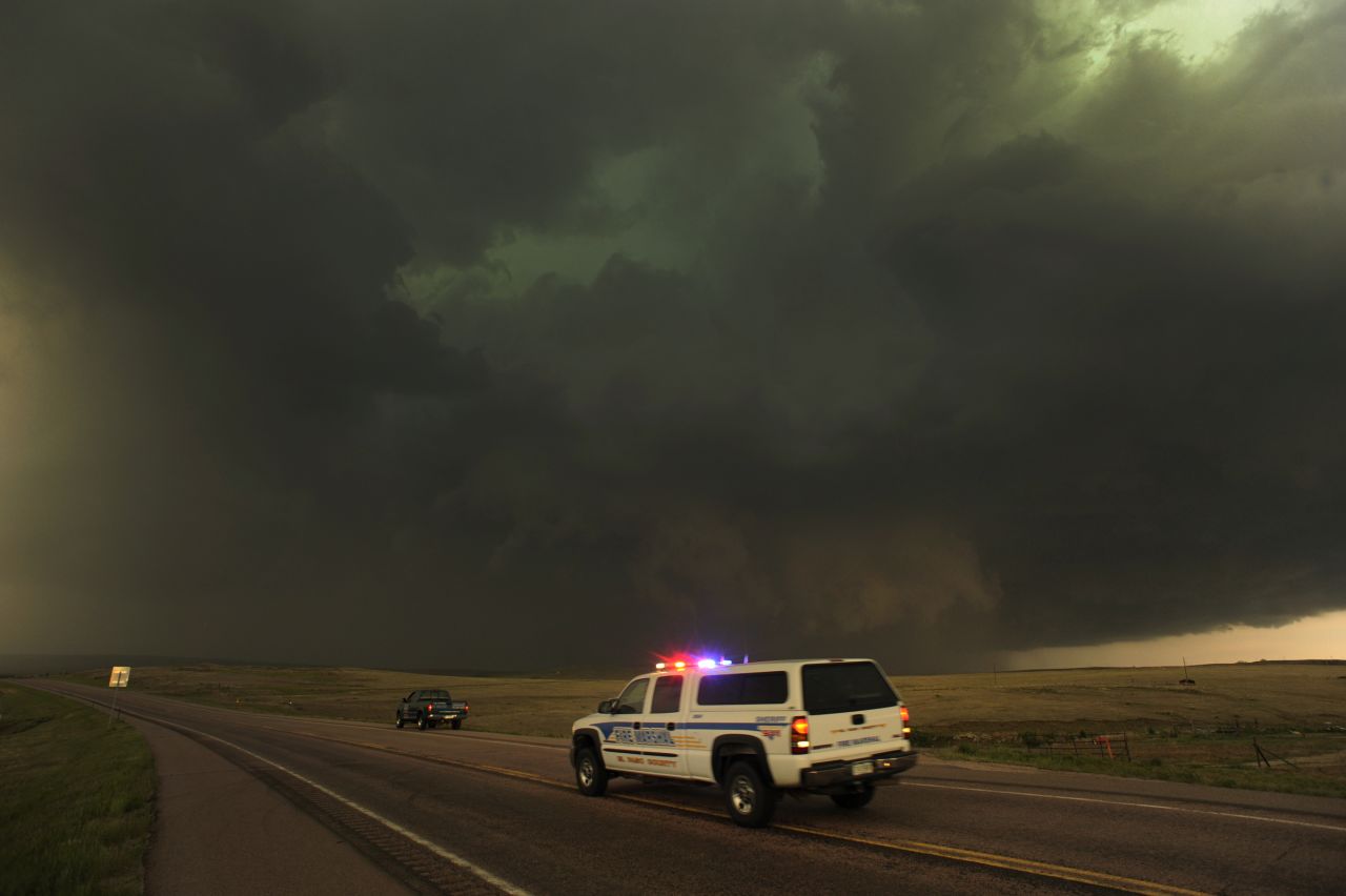 Dark storm clouds producing rain, hail and lightning move east of Calhan, Colorado, on June 7, 2012. Severe storms and damaging hail hit Colorado, New Mexico and Texas in June 2012, causing about $2.6 billion in damage.