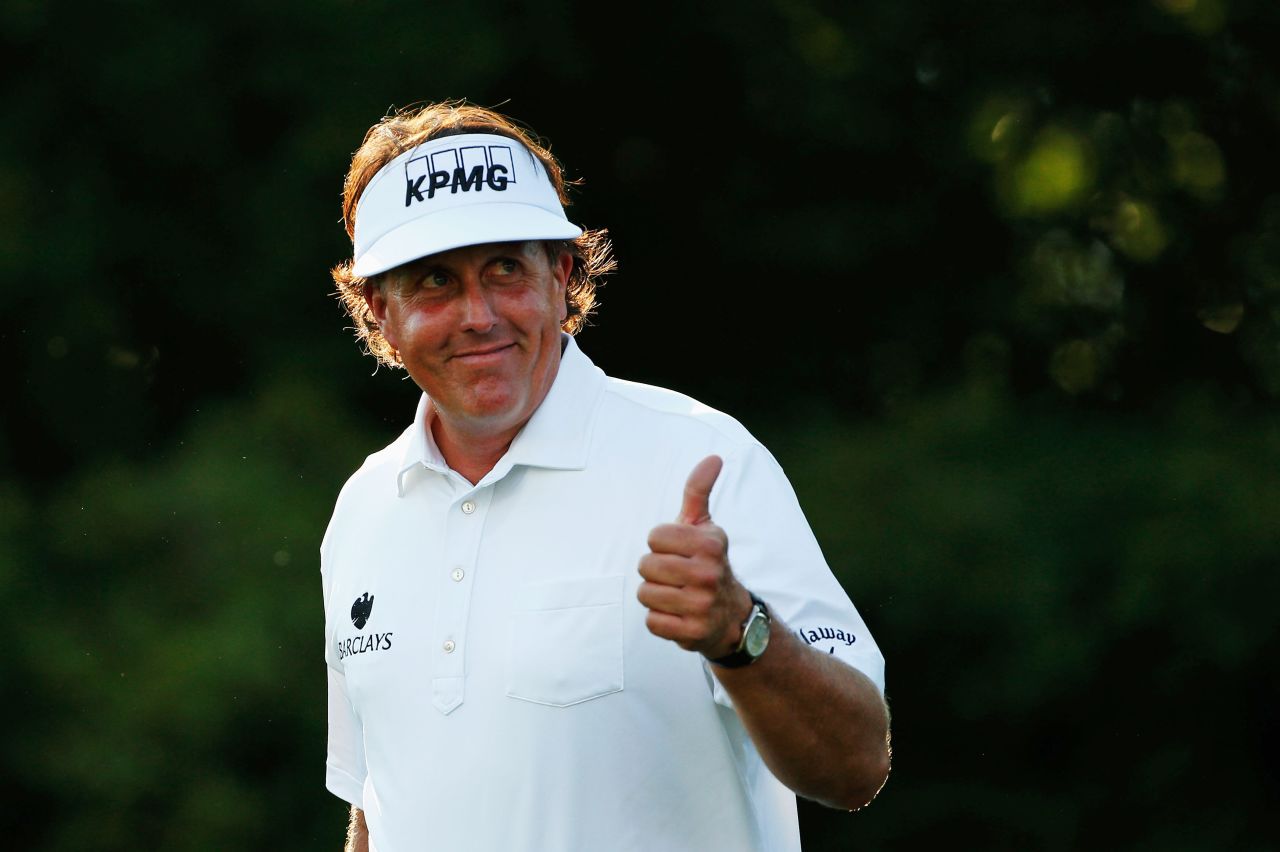 Mickelson smiles as he walks off the 11th tee during round two on June 14.