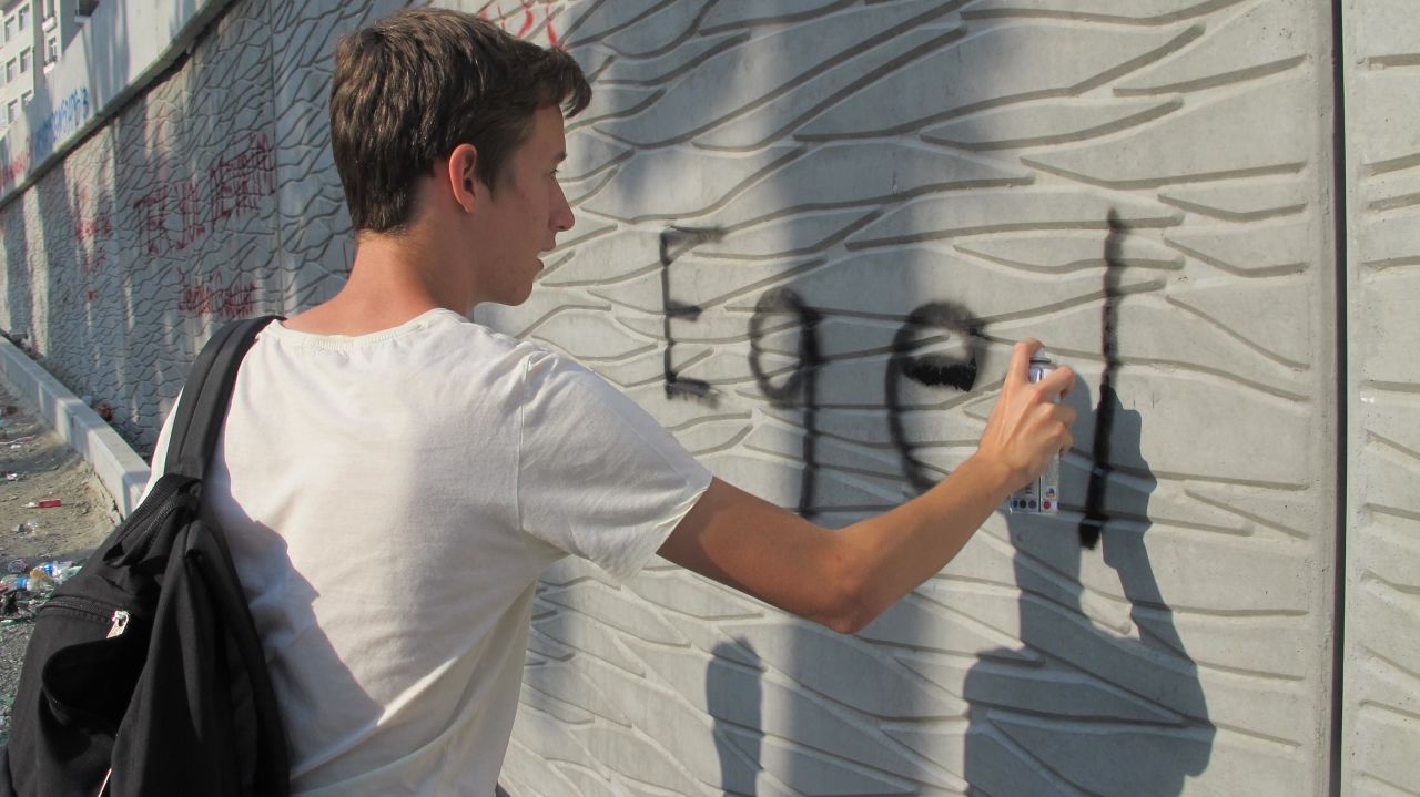 The twins were writing the words "Father Revolution" on a wall in the square. They told CNN: "I think Erdogan should go because he's not doing what society wants. It's not fair - he's becoming a dictator because he's trying to force through what he thinks is right."