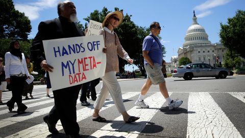 Protesters rally against the NSA's recently detailed surveillance programs June 13, 2013 in Washington, DC.