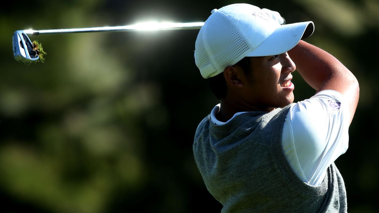 Cheng-Tsung Pan of Chinese Taipei hits his second shot on the 16th hole during a continuation of round two on June 15. 