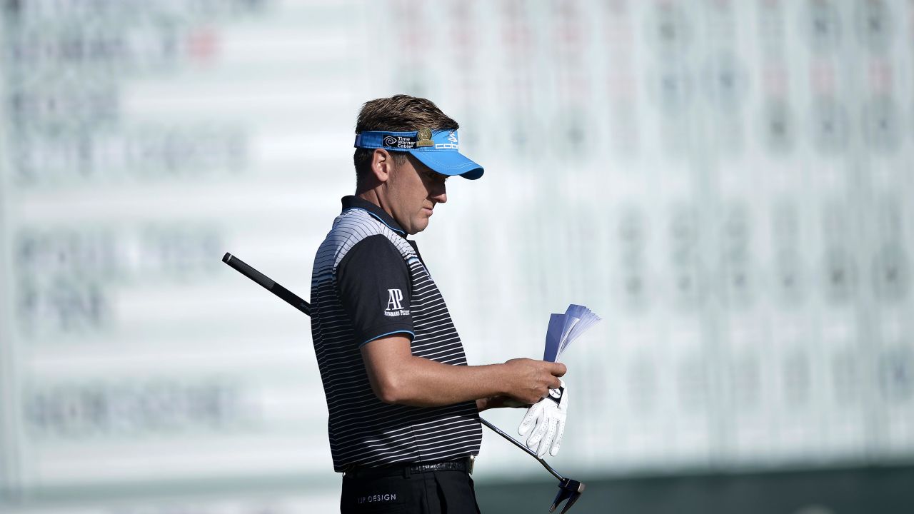 Ian Poulter of England waits to putt on the 18th green on June 15.
