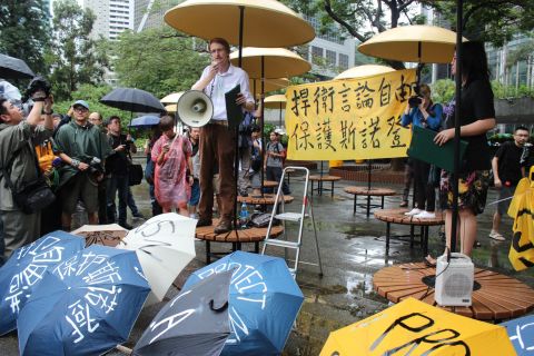 "We're rallying in order not to disappoint him and to ask Hong Kong to protect his well-being, not to extradite him, and to uphold Hong Kong law," said blogger-activist and protest co-organizer Tom Grundy (L).