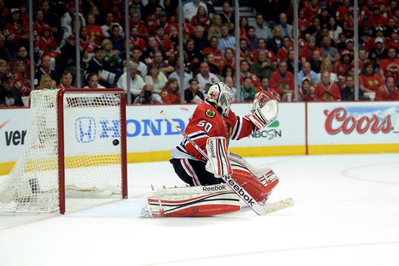 Goalie Corey Crawford of the Chicago Blackhawks lets in the game-winning goal during the first overtime. Daniel Paille of the Boston Bruins made the score.