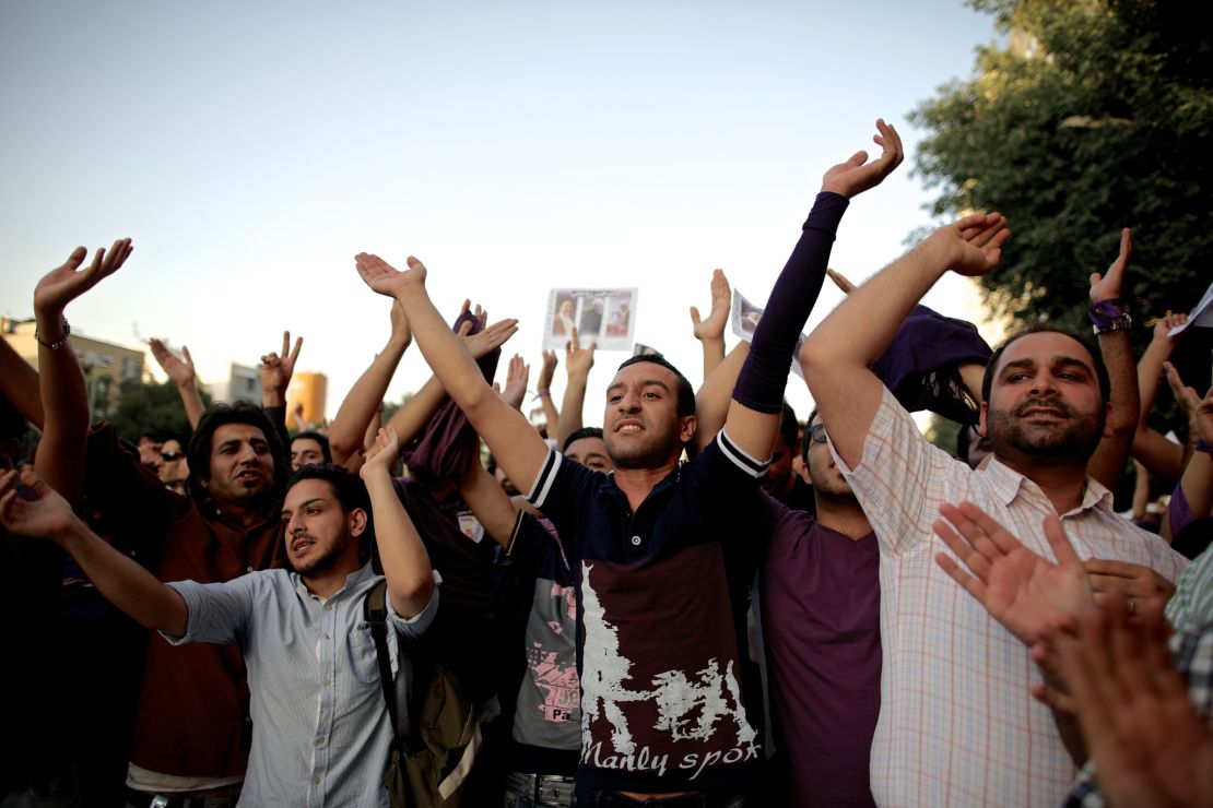 Hassan Rouhani's supporters in Tehran celebrate his victory.