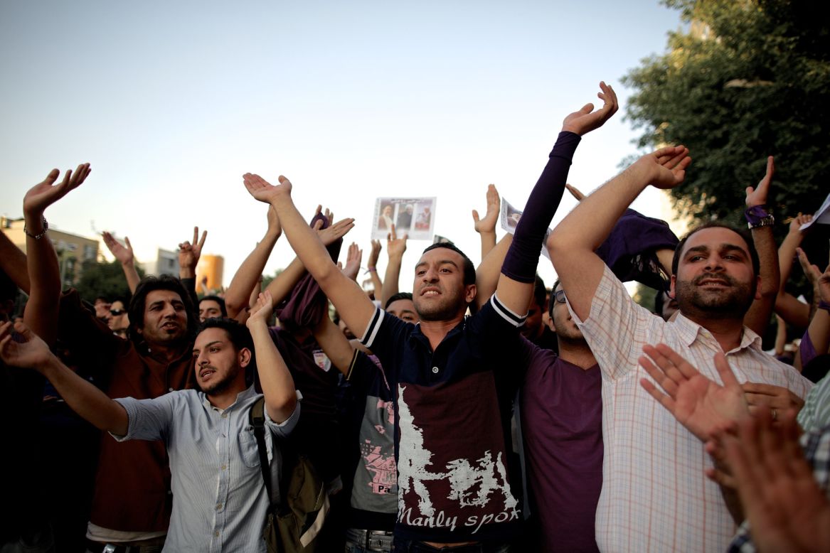 Supporters of Rouhani's celebrate his victory in downtown Tehran on Saturday, June 15.