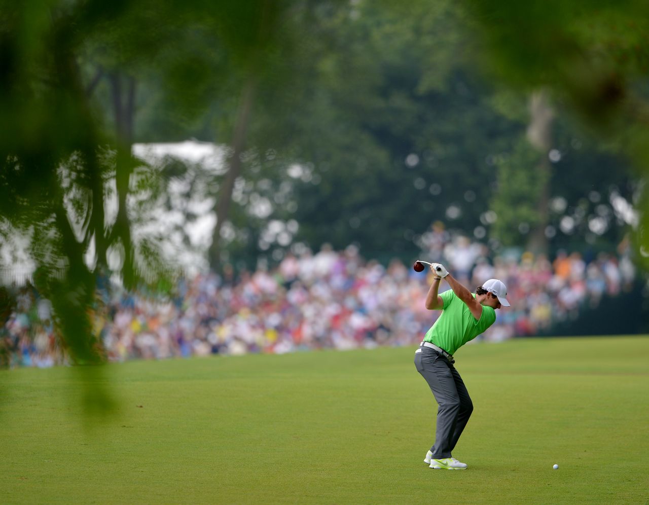 Rory McIlroy hits his second shot on the second hole.