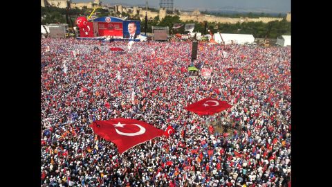Tens of thousands attend a rally to hear Turkish Prime Minister Recep Tayyip Erdogan speak in Istanbul on June 16, a day after he ordered a crackdown on anti-government protesters at Gezi Park. 