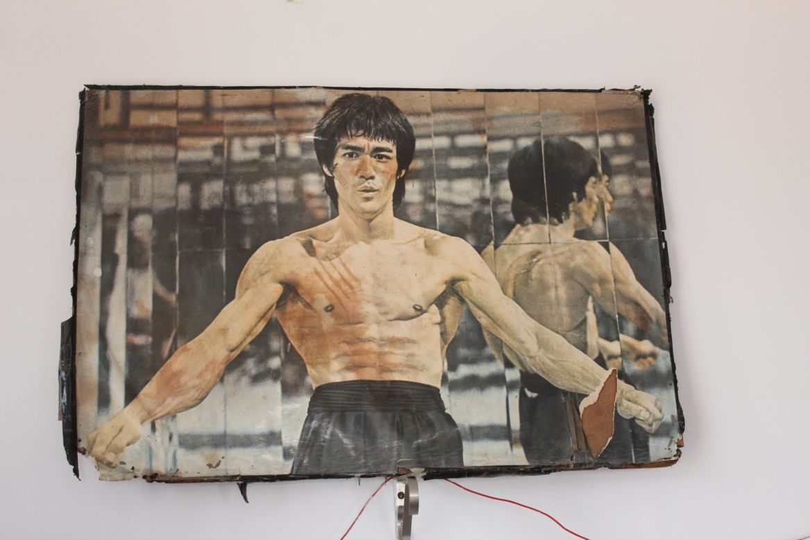 Kung Fu legend Bruce Lee surveys proceedings in the dusty martial arts gym in a Lucknow suburb.