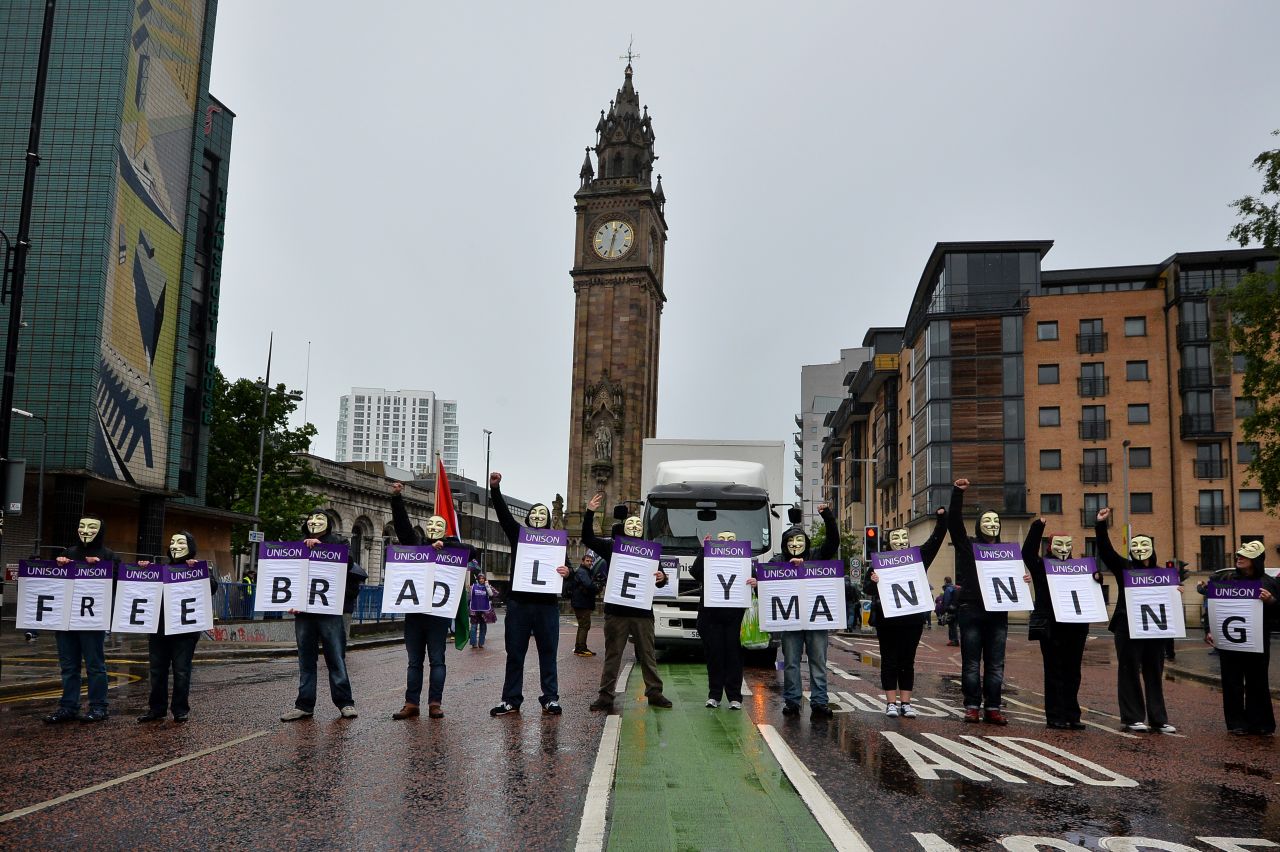 Protesters wearing Guy Fawkes masks on June 15 in Belfast hold placards spelling out the message "Free Bradley Manning," referring to the U.S. soldier <a href="http://www.cnn.com/2013/06/02/us/manning-court-martial/index.html">who has admitted</a> passing sensitive U.S. government material to the leak website WikiLeaks.